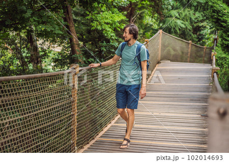 Man tourist in Rope bridge in Yildiz Park. Besiktas, Istanbul, Turkey. Turkiye 102014693