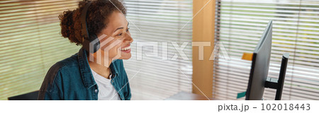 Woman designer works in home office drawing on graphic tablet. Freelancer working on project 102018443