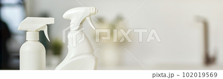 Clean up. Close up shot of detergent bottles and stack of rugs on kitchen surface Clean up. Close up shot of detergent bottles and stack of rugs on kitchen surface 102019569
