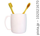 a wooden-handled toothbrush 102021670