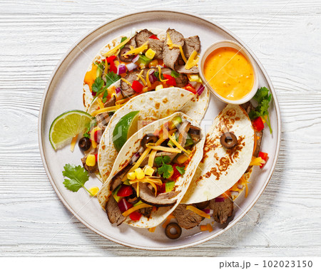 Beef Steak Tacos with veggies, avocado, corn Beef Steak Tacos with veggies, avocado, corn 102023150