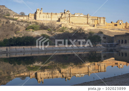 Amber fort located high on a hill is known for its artistic style elements, with large ramparts and series of gates and cobbled paths. The fort overlooks Maota Lake, the main source of water for the 102023899