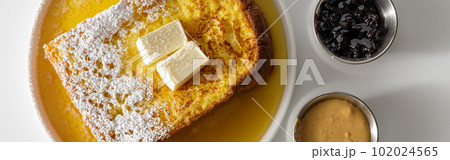Butter melting on fresh piece of bread Butter melting on fresh piece of bread 102024565