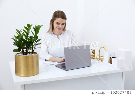 Female doctor make online video call consulting patient on laptop. Medical assistant young woman therapist videoconferencing to web camera. Telemedicine concept. Online doctor appointment. Female doctor make online video call consulting patient on laptop. Medical assistant young woman therapist videoconferencing to web camera. Telemedicine concept. Online doctor appointment. 102027403