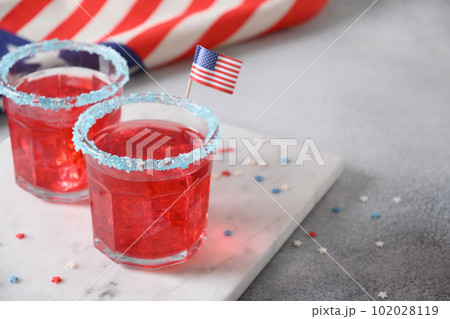 Patriotic red pomegranate margarita for July 4th. 102028119
