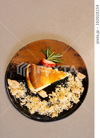 Burnt cheese cake with fruit decorate, Dessert background Burnt cheese cake with fruit decorate, Dessert background 102028154