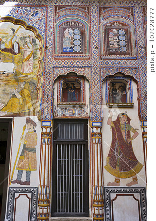 Colourful paintings on the inner wall of Dr. Ramnath Podar Haveli Museum, a cultural heritage museum which houses Rajasthani living style, miniature paintings, textiles, jewellery, and other items, 102028777