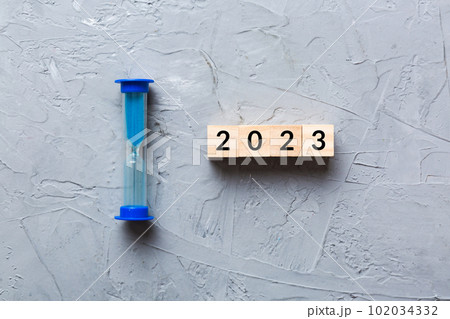 New Year 2023 sand timer. Resolution, time, plan, goal, motivation, reboot, countdown and New Year holiday concepts. Hourglass with number 2023 102034332