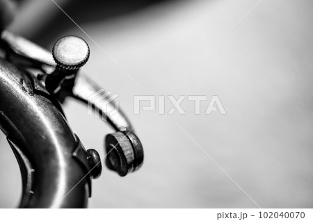 Selective focus on a water key of an aged wind instrument trumpet. Selective focus on a water key of an aged wind instrument trumpet. 102040070