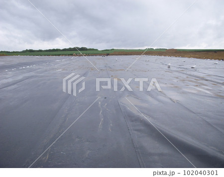 Landfill expansion project with unrolled HDPE synthetic liner. 102040301