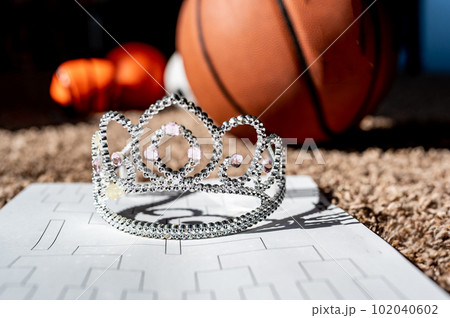 Basketball, tiara, and blank bracket signifying a Cinderella season. Basketball, tiara, and blank bracket signifying a Cinderella season. 102040602