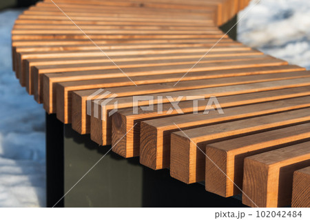 Bent wooden bench construction. Abstract architecture background Bent wooden bench construction. Abstract architecture background 102042484