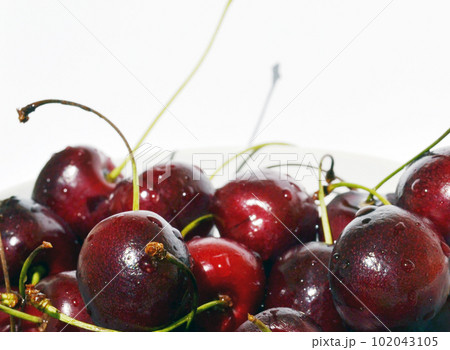 Cherry in a bowl on a white background. Cherry in a bowl on a white background. 102043105