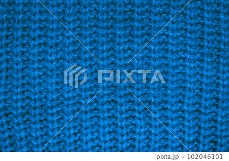 Handmade knitted texture with detail wool threads. 102046101