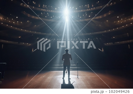 Fictional male artist on the big stage of an empty concert hall in the light of spotlights made with generative AI Fictional male artist on the big stage of an empty concert hall in the light of spotlights made with generative AI 102049426