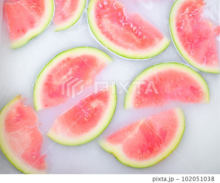 Turbid soapy water in bath with slices of watermelon. top view in full frame. The largest berry. spa with milk in the bath for rejuvenation.Ripe fruit. Turbid soapy water in bath with slices of watermelon. top view in full frame. The largest berry. spa with milk in the bath for rejuvenation.Ripe fruit. 102051038