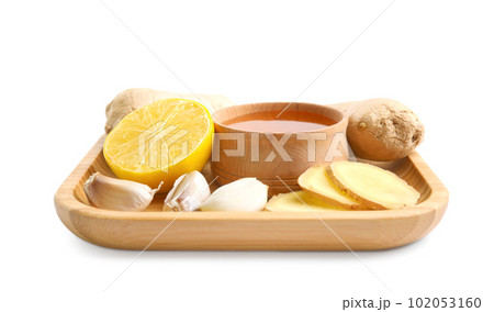 Fresh garlic and other natural cold remedies isolated on white Fresh garlic and other natural cold remedies isolated on white 102053160