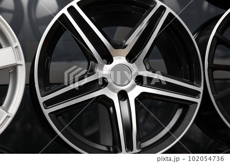Alloy wheel in auto store, closeup view Alloy wheel in auto store, closeup view 102054736