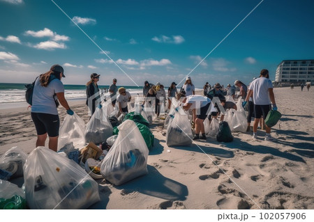 A group of volunteers wearing gloves and carrying reusable bags participate in a beach cleanup event. They are collecting plastic waste, including bottles, bags, and other debris. Generative AI 102057906