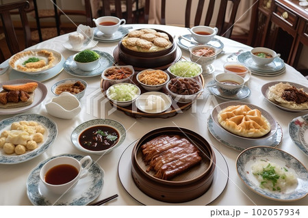 A delicious, Chinese meal, highlighting a variety of dishes such as Peking duck, mapo tofu and dumplings, served on a lazy Susan or large table, encouraging sharing and togetherness. Generative AI 102057934