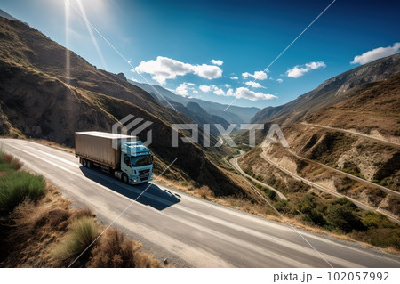 A scenic view of a truck driving through mountains: The image show a transport truck driving through a winding road in the mountains. Generative AI A scenic view of a truck driving through mountains: The image show a transport truck driving through a winding road in the mountains. Generative AI 102057992