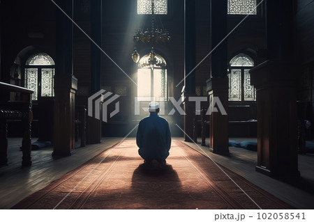 A man praying at a mosque. Man s devotion as he prays. The mosque be shown in the background to emphasis on the spiritual aspect of Ramadan. Generative AI. A man praying at a mosque. Man s devotion as he prays. The mosque be shown in the background to emphasis on the spiritual aspect of Ramadan. Generative AI. 102058541