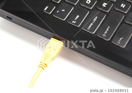 laptop with USB orange cable. 102088031