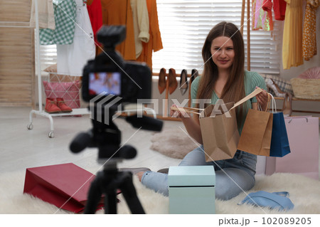 Fashion blogger recording new video in room 102089205