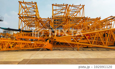 A stack of crane boom, lower section, middle section, upper section, and crane fly jib. A stack of crane boom, lower section, middle section, upper section, and crane fly jib. 102091120