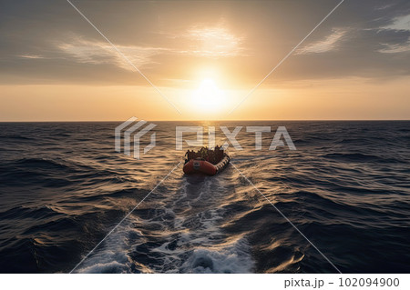refugees in boat crossing the sea refugees in boat crossing the sea 102094900