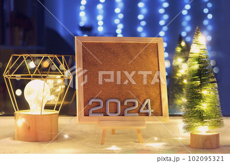 The numbers new year 2024 on a beautiful easel The numbers new year 2024 on a beautiful easel 102095321