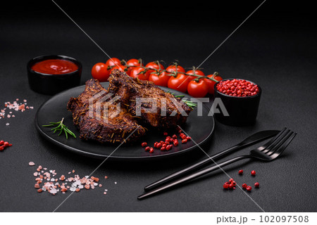 Delicious beef or pork steak on the bone grilled with spices and rosemary 102097508