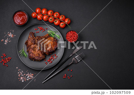 Delicious beef or pork steak on the bone grilled with spices and rosemary 102097509