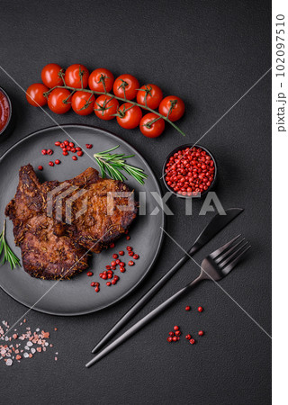 Delicious beef or pork steak on the bone grilled with spices and rosemary 102097510
