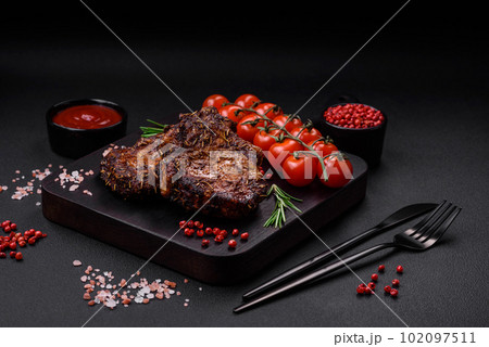 Delicious beef or pork steak on the bone grilled with spices and rosemary 102097511