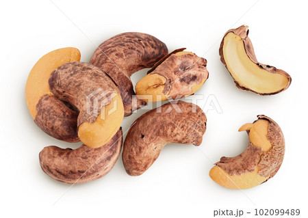 cashew nuts heap with shell isolated on white background. Top view. Flat lay cashew nuts heap with shell isolated on white background. Top view. Flat lay 102099489