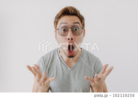 Wow face of man in eye glasses and colored hair isolated on white. Wow face of man in eye glasses and colored hair isolated on white. 102110258