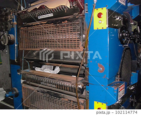 machines on a large printing plant factory, printing of books bad working conditions in asia sweat shop factory machines on a large printing plant factory, printing of books bad working conditions in asia sweat shop factory 102114774