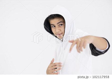 young boy teenager in hiphop dancing action on white background young boy teenager in hiphop dancing action on white background 102117958