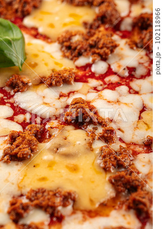 Huge pizza with cheddar cheese and minced beef Huge pizza with cheddar cheese and minced beef 102118966