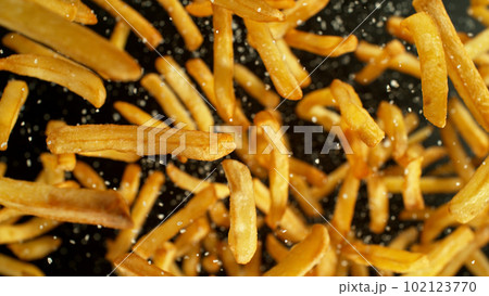 French fries - fried potatoes flying. 102123770