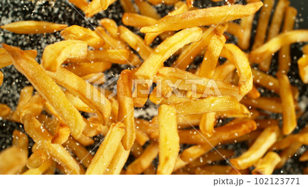 French fries - fried potatoes flying. 102123771