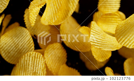 Potatoes chips flying up in the air. Potatoes chips flying up in the air. 102123776