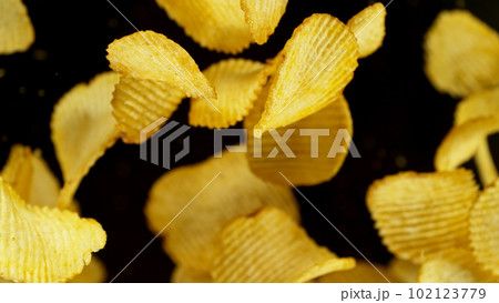 Potatoes chips flying up in the air. Potatoes chips flying up in the air. 102123779