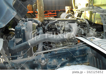 Diesel truck engine or truck engine with copy space for text. Metallic background of the internal diesel truck engine or car engine. Diesel truck engine or truck engine with copy space for text. Metallic background of the internal diesel truck engine or car engine. 102125852