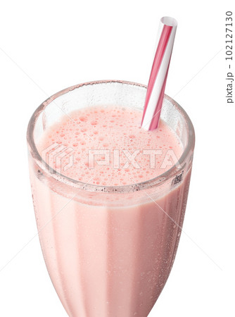 closeup of cold strawberry milkshake in glass with straw isolated on white 102127130