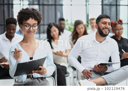 people sitting in business seminar room in hotel business 102129476