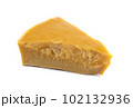 A piece of natural beeswax on a white background. 102132936