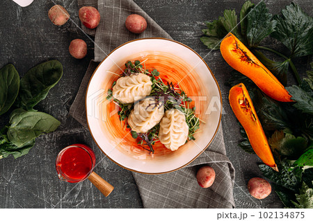 Portion of manti dumplings stuffed with pumpkin Portion of manti dumplings stuffed with pumpkin 102134875