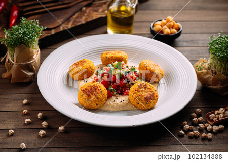 Portion of vegetarian falafels with hummus Portion of vegetarian falafels with hummus 102134888